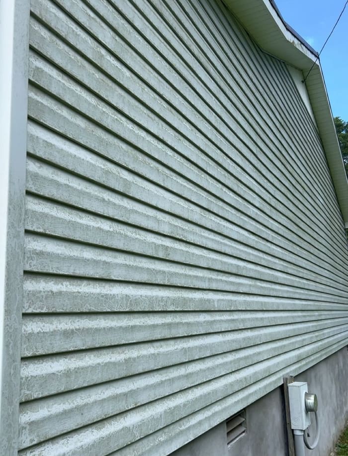 Light green siding with mold before house washing in Athens, GA