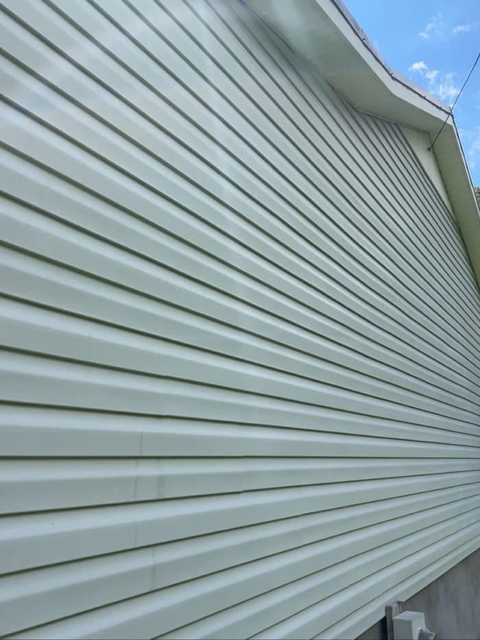 Clean light green siding after house washing in Athens, GA