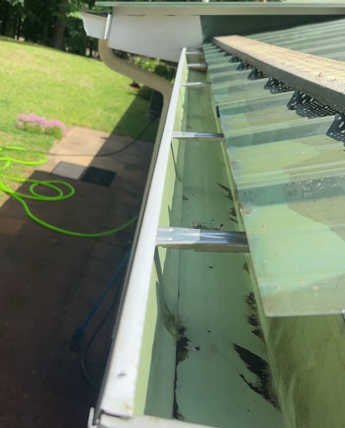 Clean gutter ready for water flow after cleaning in Athens, GA