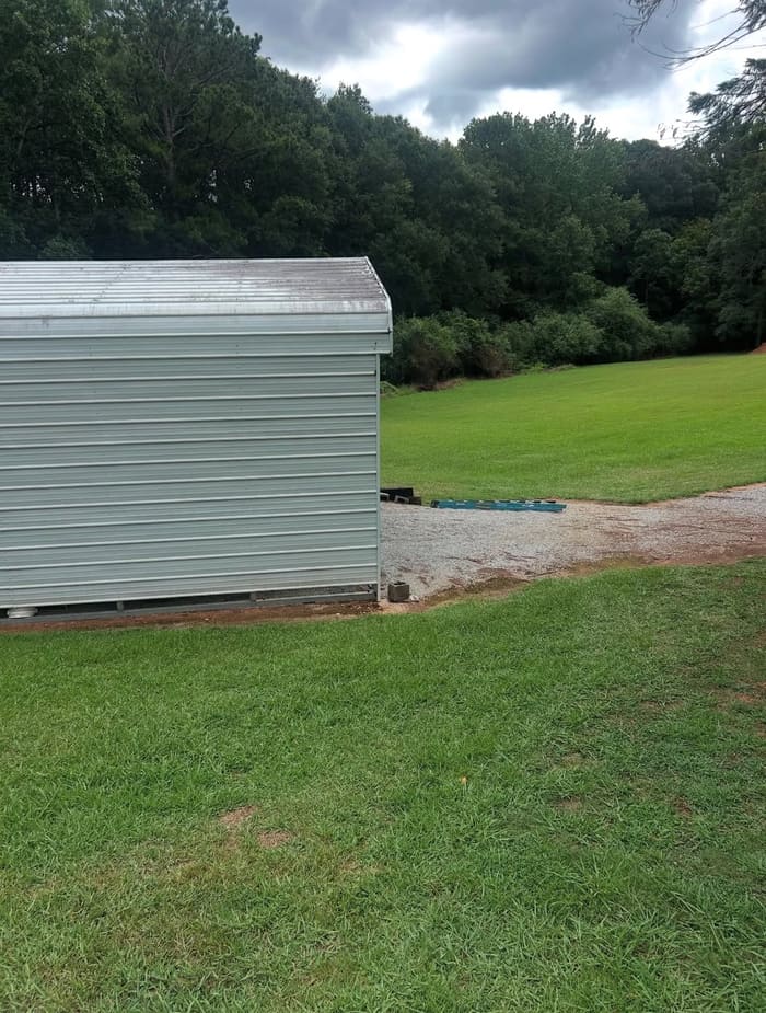 Dirty metal shed siding with oxidation before washing in Athens, GA