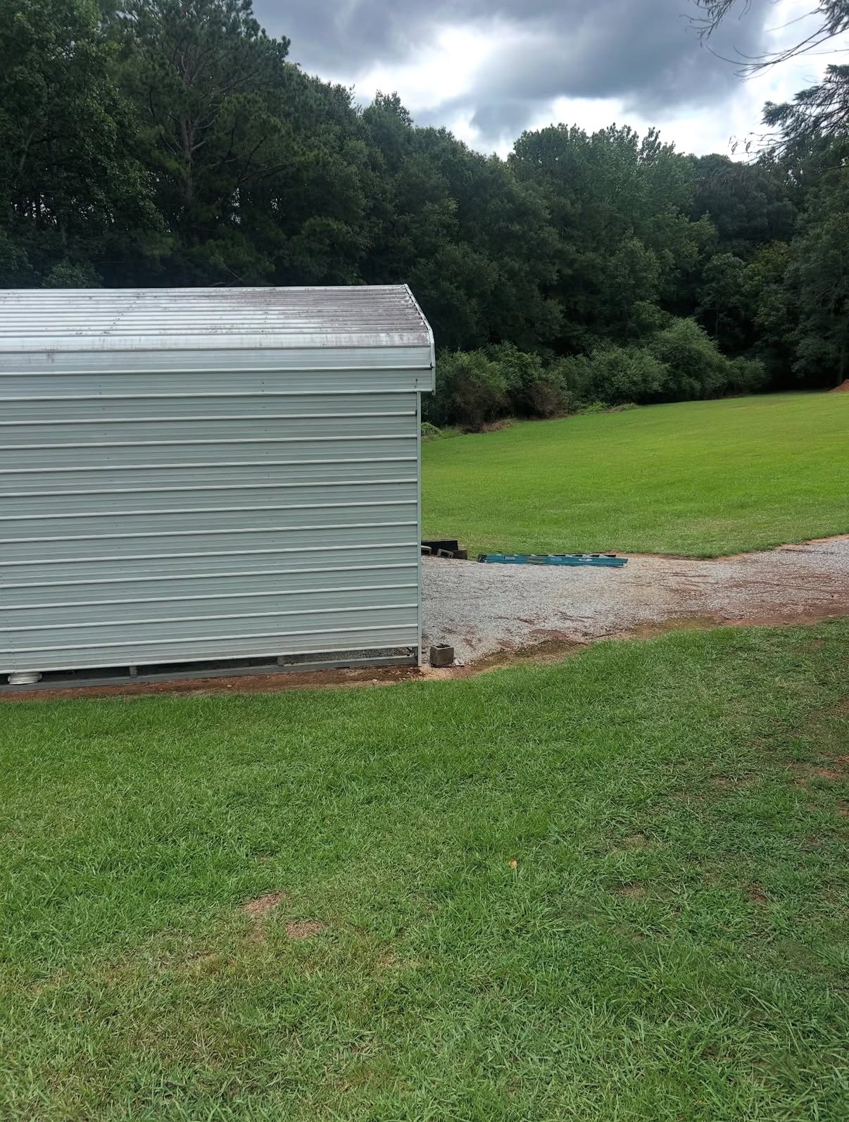 Dirty metal shed siding with oxidation before washing in Athens, GA