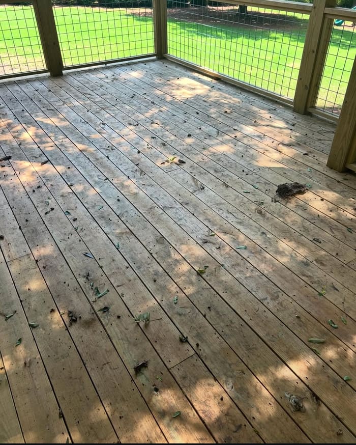 Weathered deck with dirt and debris before cleaning in Athens, GA