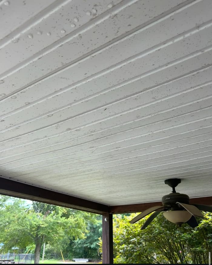 Stained porch ceiling before cleaning in Athens, GA
