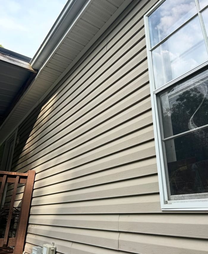 Clean beige siding after house washing in Athens, GA