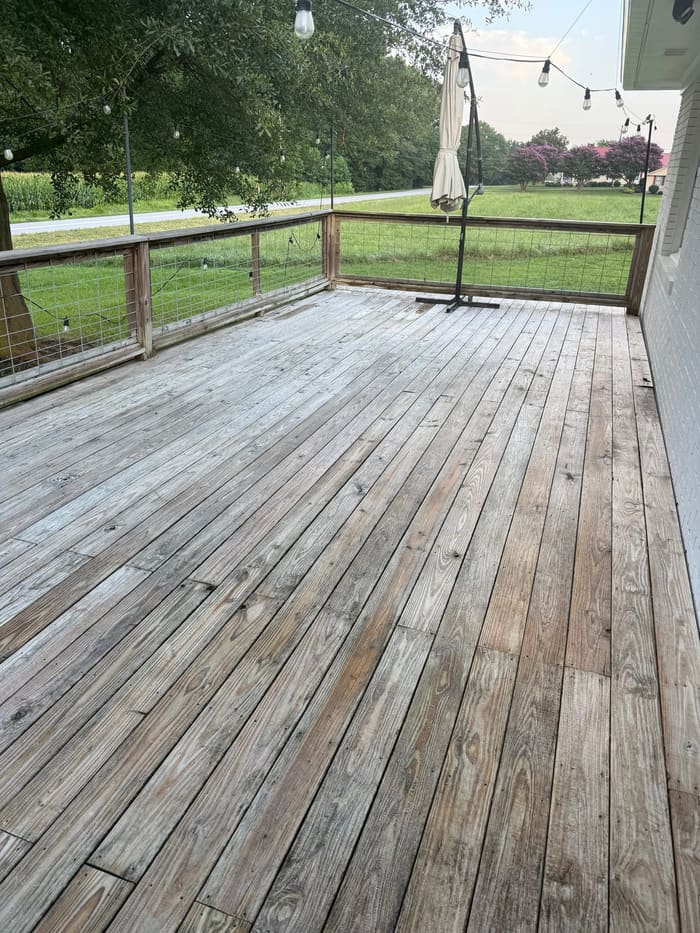 Wood porch deck with railing and string lights in Athens, GA