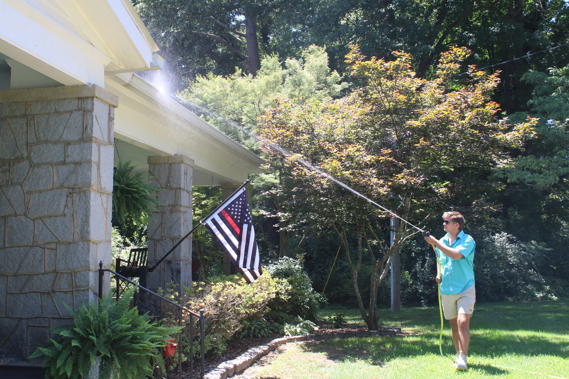 O.N.B Pressure Washing soft washing a gray wood deck in Athens, GA