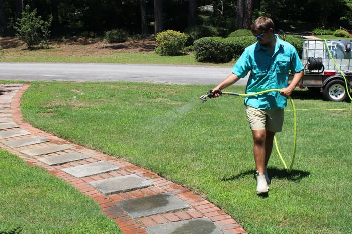 O.N.B Pressure Washing technician cleaning an exterior surface in Athens, GA